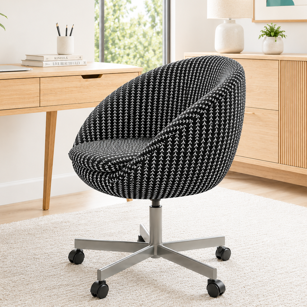 Modern office chair in a home office setting with a desk and decor.