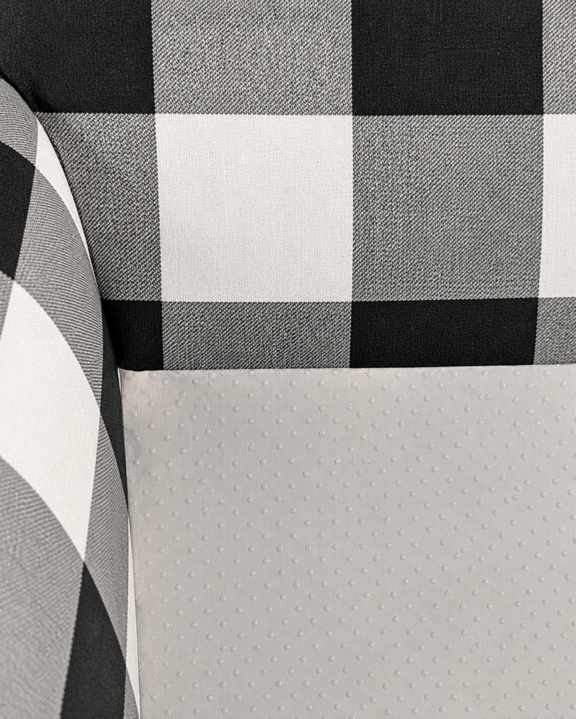 Close-up of a black and white checkered fabric with a textured gray surface.
