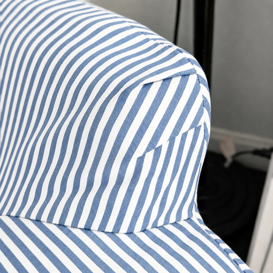 Close-up of a blue and white striped fabric chair
