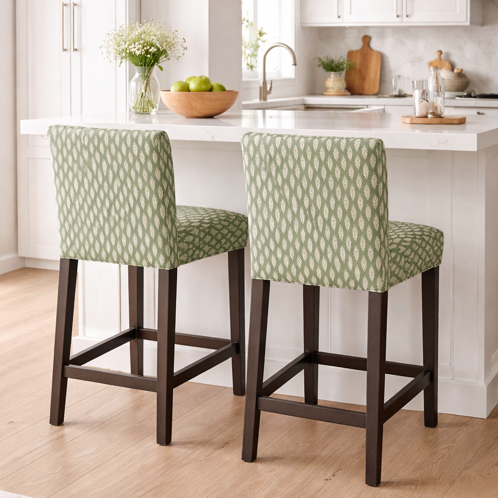 Two green patterned bar stools in a kitchen setting.
