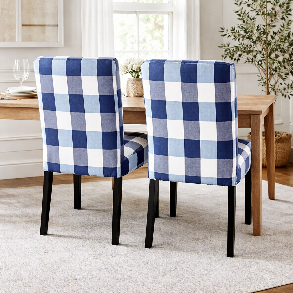 Two blue and white checkered chairs in a dining room setting.