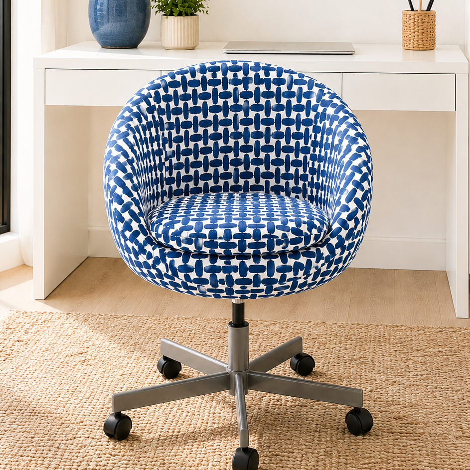 Blue patterned office chair in front of a desk with a beach view.