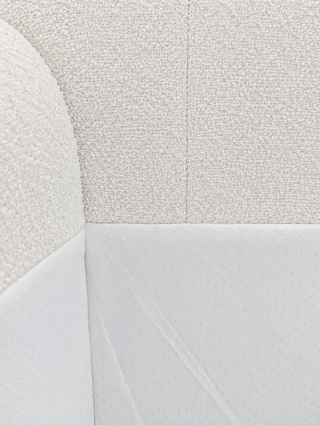 Close-up of a textured white fabric surface