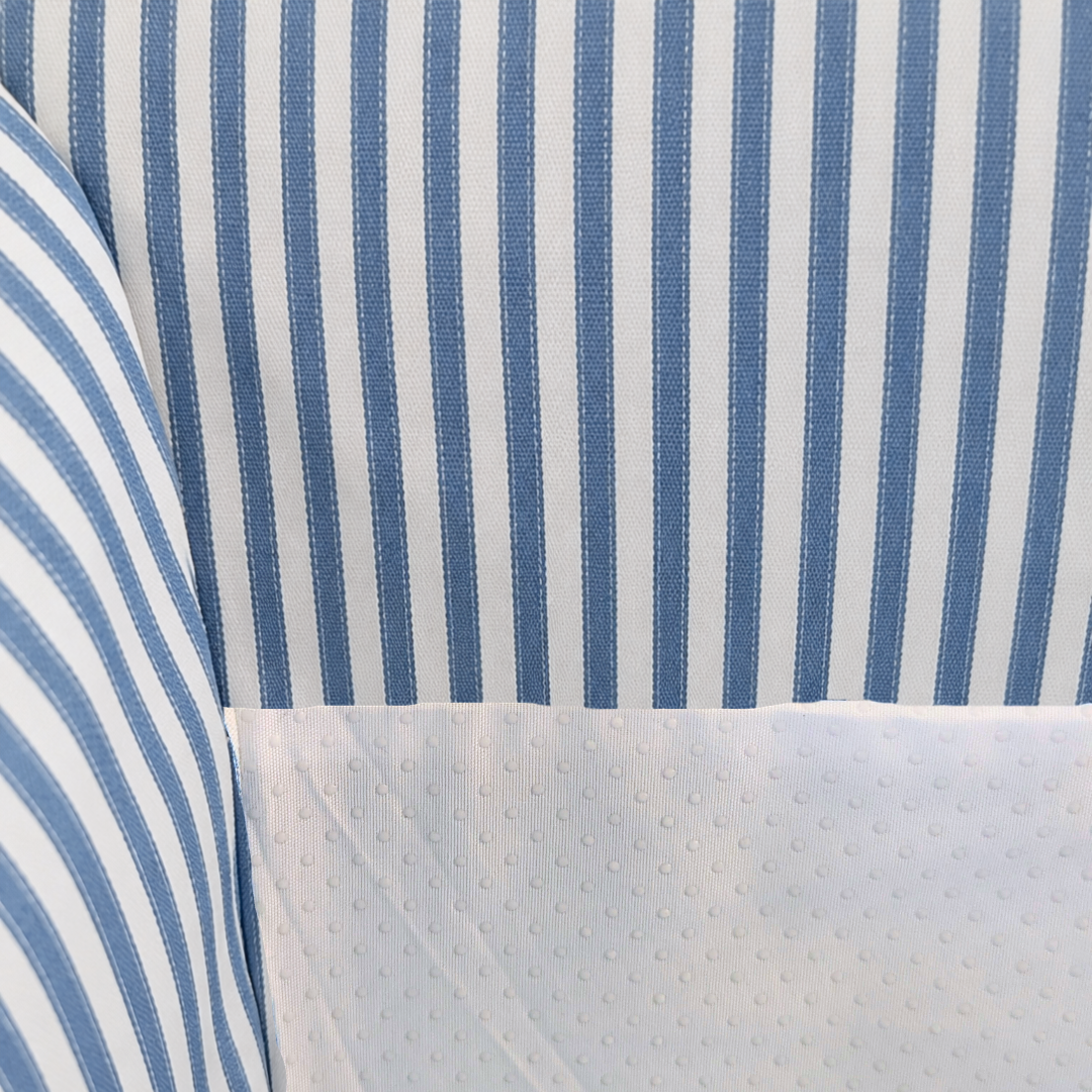 Close-up of blue and white striped fabric with a textured pattern.