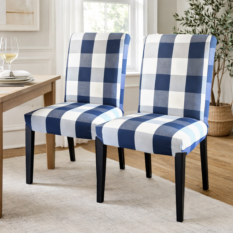 Two blue and white checkered chairs in a dining room setting.