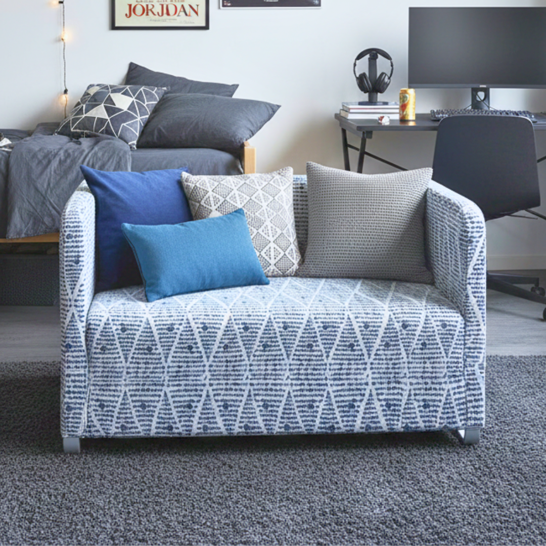 Patterned sofa with colorful cushions in a living room setting