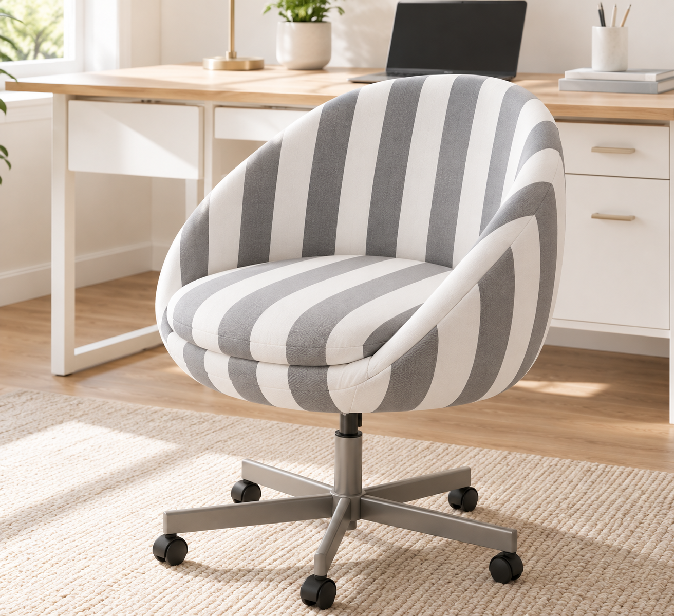 Angled view of grey and white striped SKRUVSTA chair cover