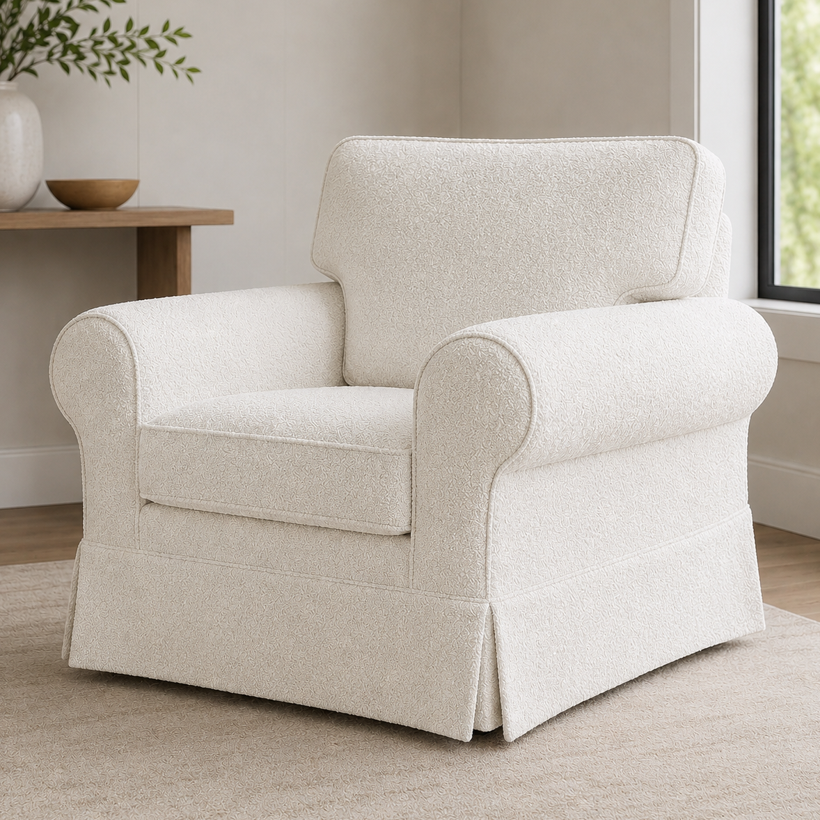 White boucle armchair in a room with a small table and plants.
